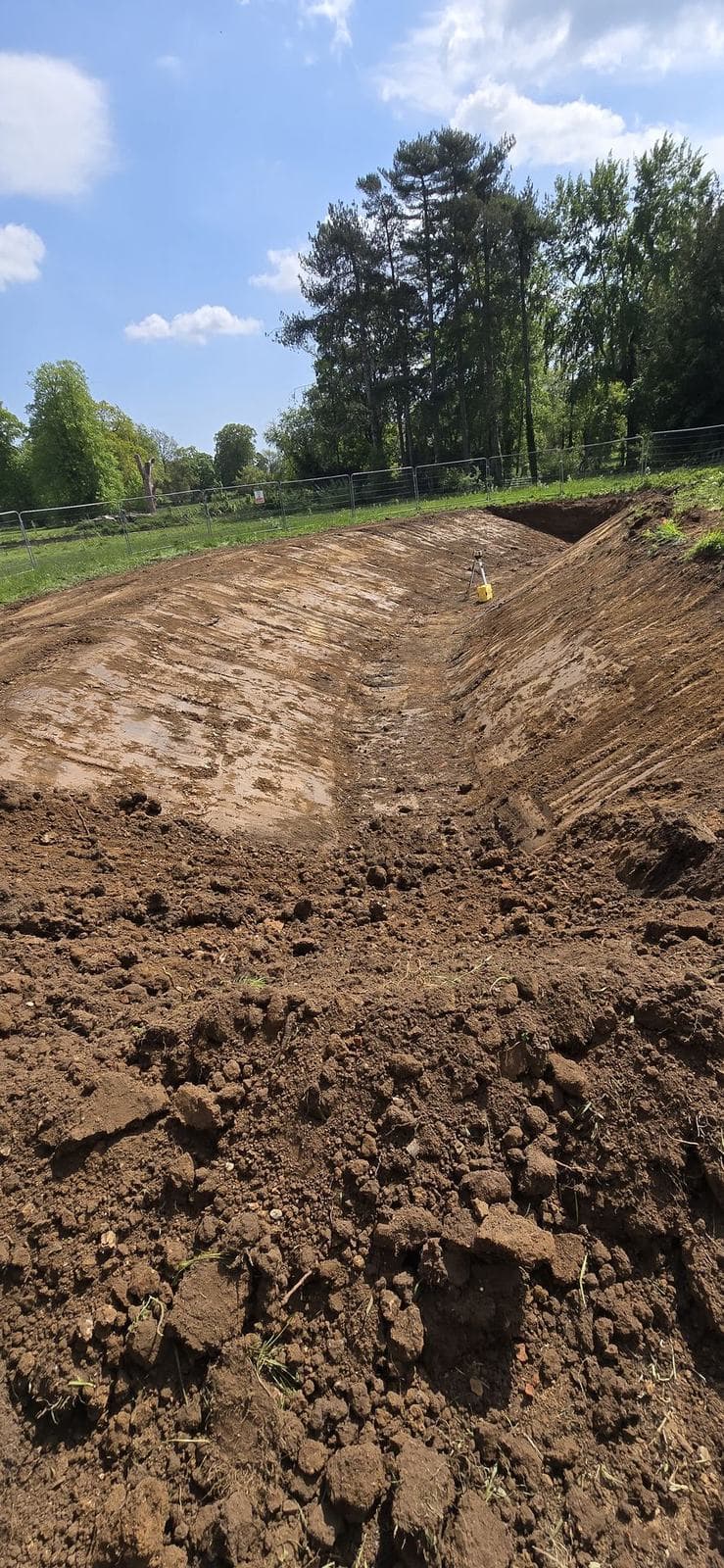 Graded earthworks cut formed in parkland
