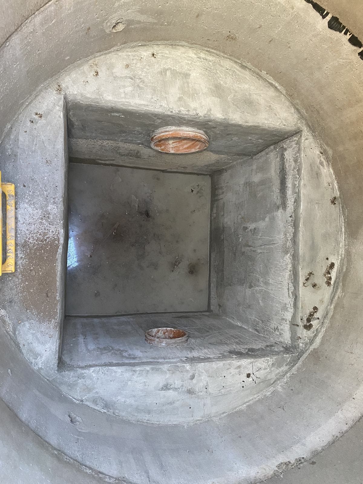 Benching and channel detail formed inside a precast manhole chamber