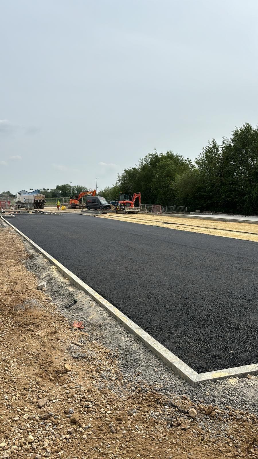 Binder course laid up to a concrete kerb race on a new estate road